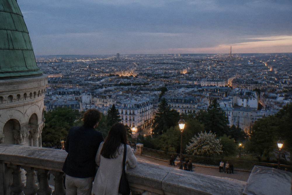 Evening view over Paris rooftops from the terrace in front of Sacre-Coeur