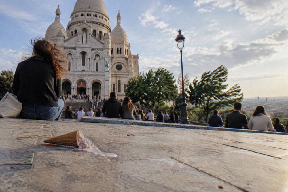 The open viewing terrace in front of the Sacre-Coeur basilica seen from the top of the Montmartre hill