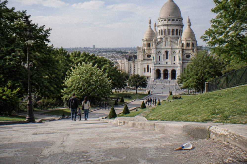 The stone staircase and sloping lawns leading up to the basilica's entrance on the hilltop