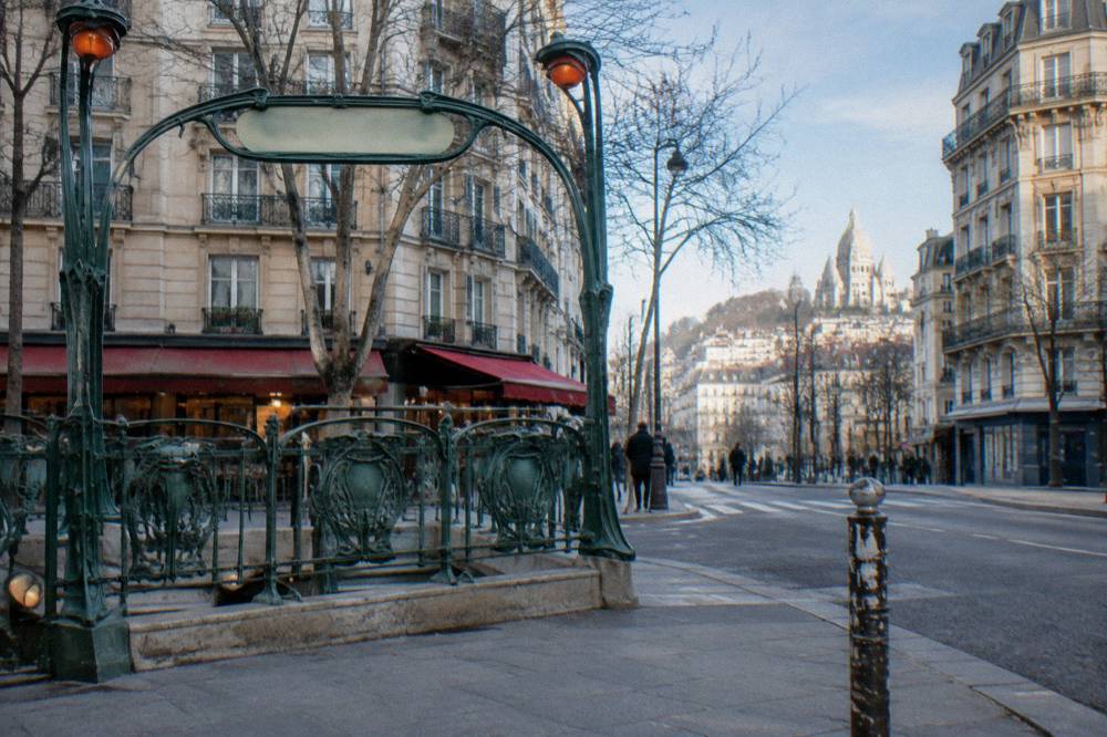 Boulevard de Clichy outside the Blanche metro station with the Moulin Rouge facade in daylight